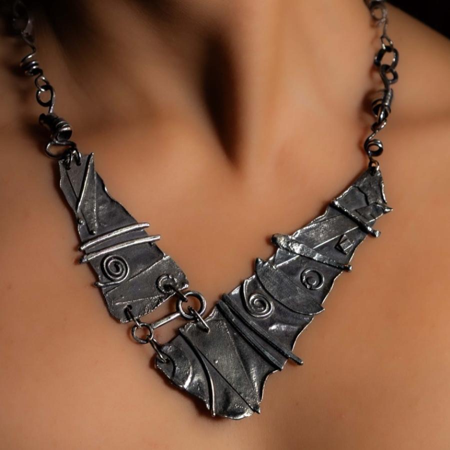 Model wearing a rough silver necklace