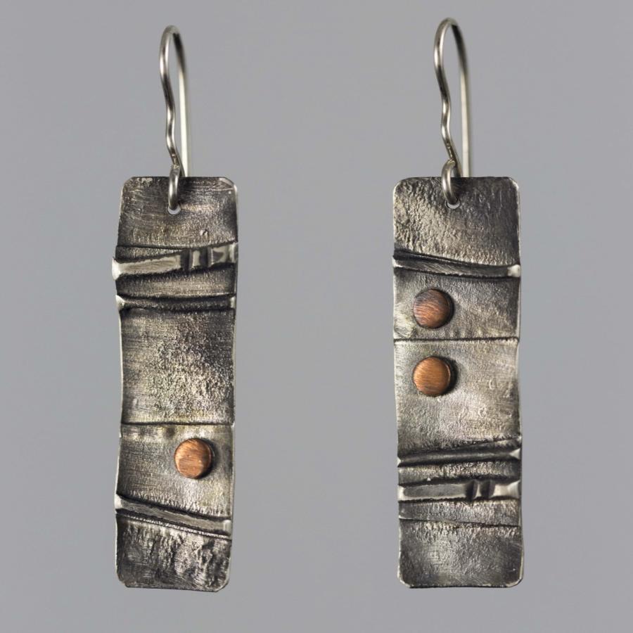 Silver earrings with copper accents