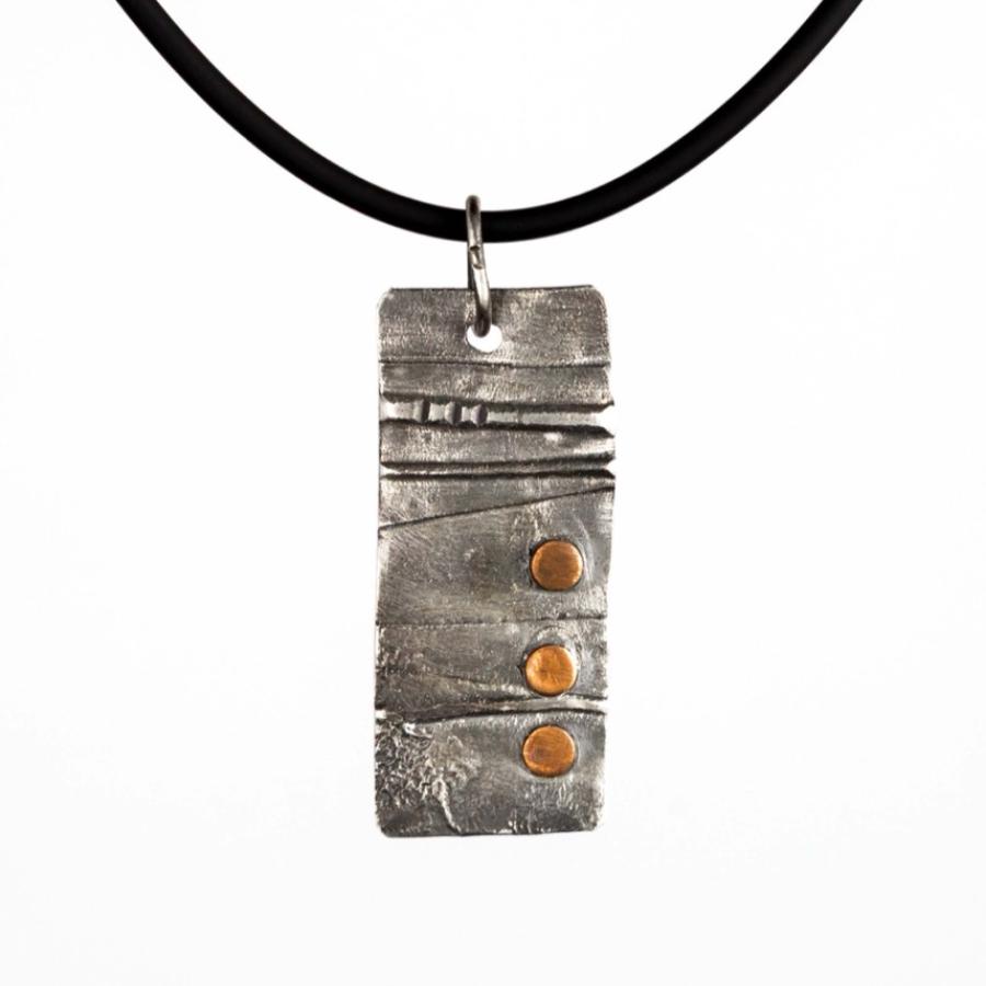 Silver pendant with copper accents