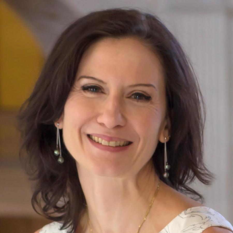 Photo of a woman in a white dress