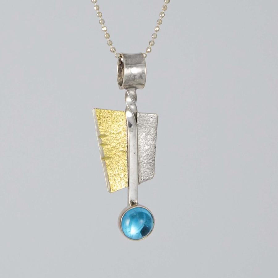 Gold and silver textured pendant necklace with a small, round blue stone.