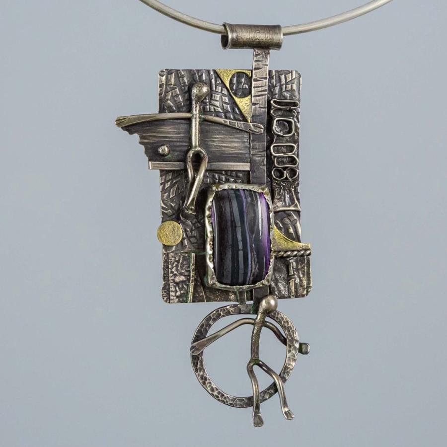 A photograph of an abstract metal pendant with a purple stone on a silver choker necklace.