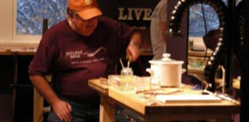 Workshopper Doyle at the solder station