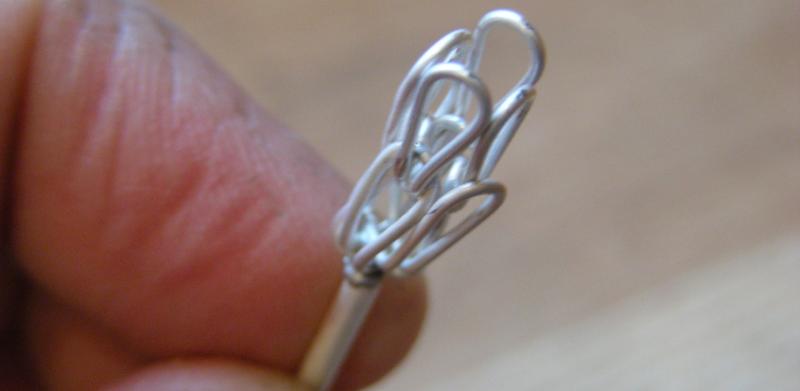 The beginning “sprout” of a woven chain. It takes several feet of wire to make an inch.