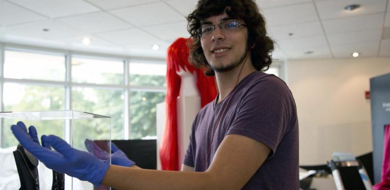 David polishing the show's acrylic cases