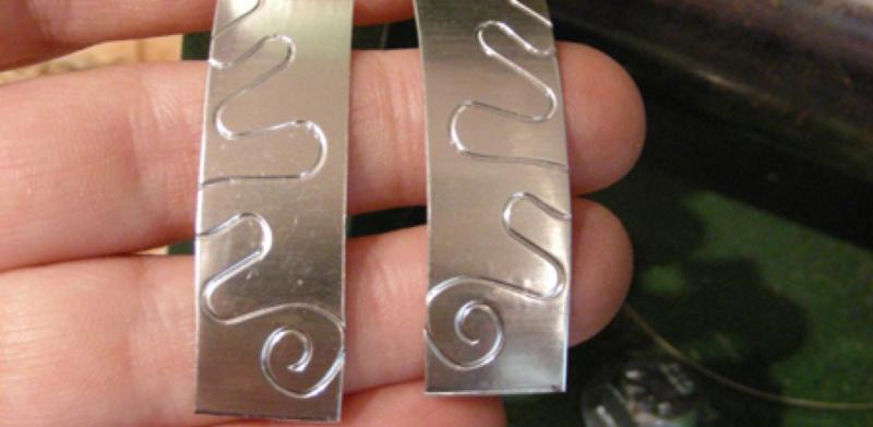 Silver with an embossed pattern