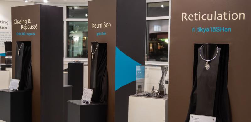 Jewelry on display in a exhibit.