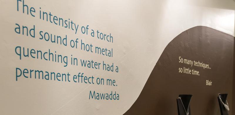 Jewelry display with quote on wall.