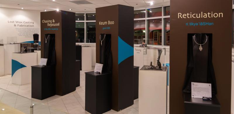 Jewelry exhibit in a gallery.