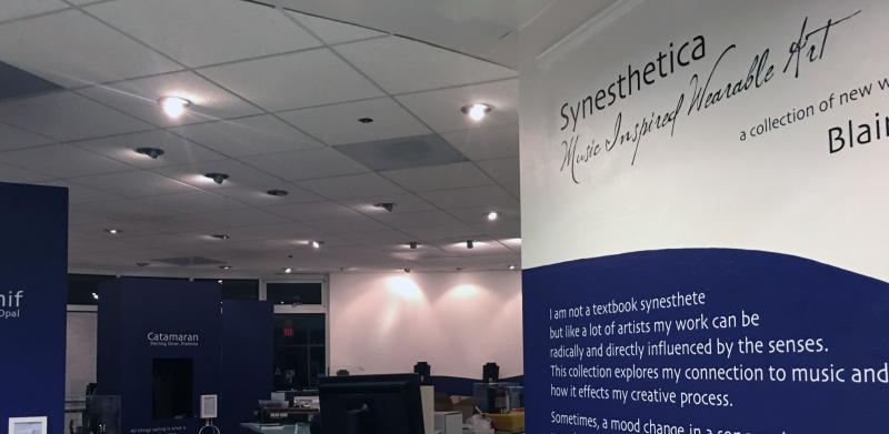 Art exhibit entrance with signage.