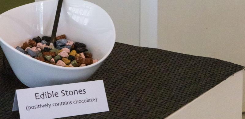 Candy displayed on white pedestals, in jewelry exhibit..