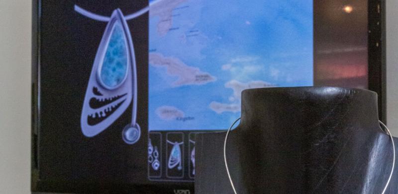 Necklace display with interactive exhibit.