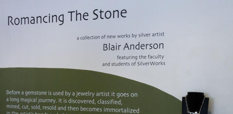 Display of jewelry artwork exhibit, “Romancing The Stone.”