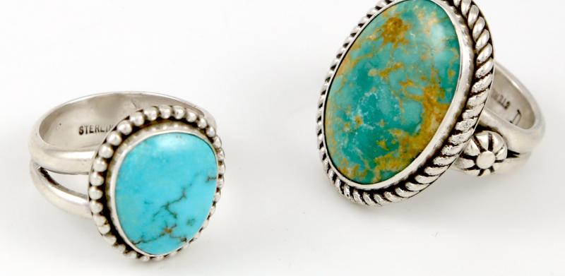 Two rings with blue/green stones