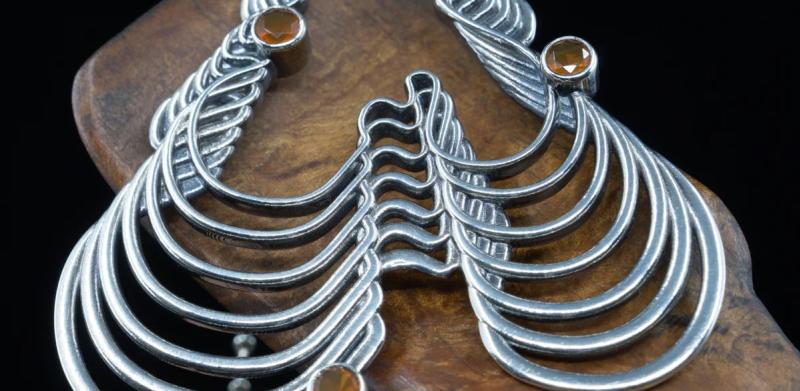 Silver pendant with yellow stones