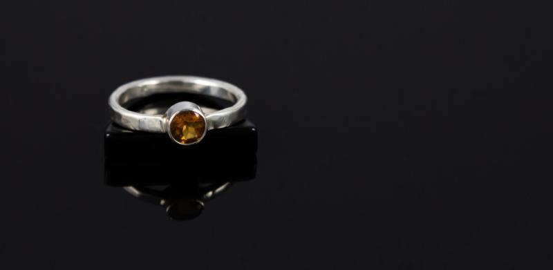 Silver ring with a yellow stone