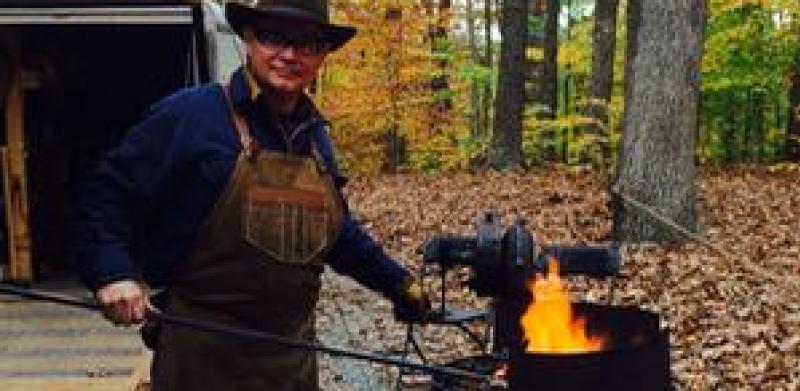 Man doing a blacksmithing demo