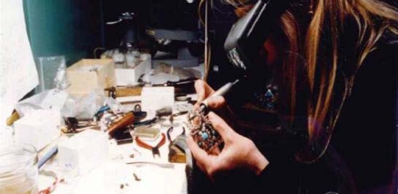 A woman working on Jewelry