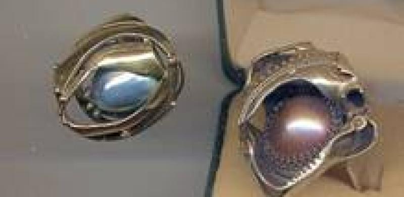 Three silver rings with different stones