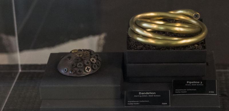 Photograph of creative jewelry in a display case.