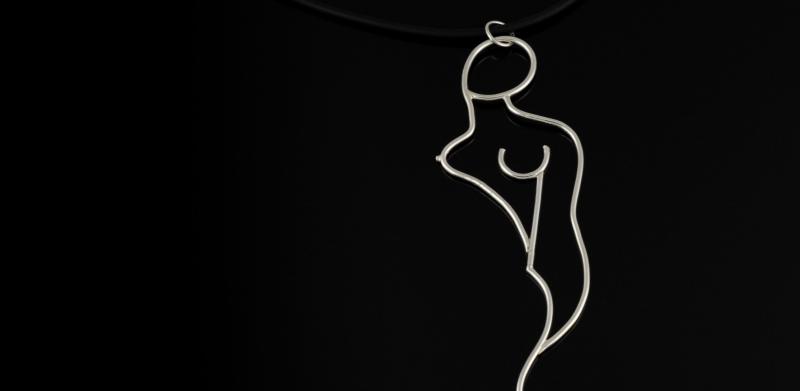 A silver wire pendant shaped like a stylized female silhouette on a black cord.
