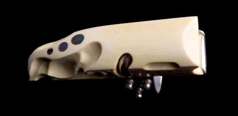 Photograph of a carved ivory and silver ring