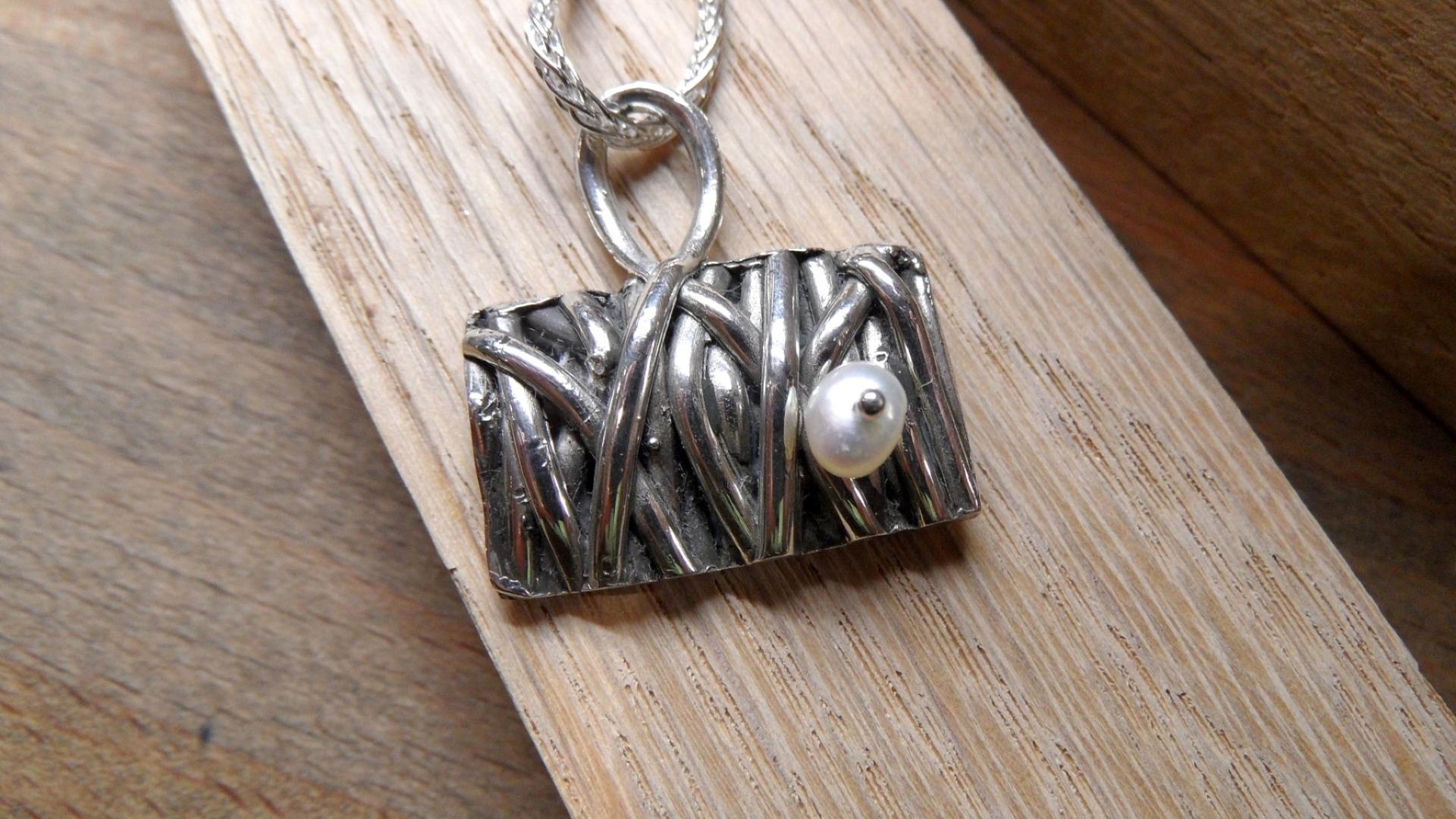 Cast silver pendant with pearl