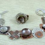 a copper and silver riveted bracelet