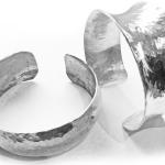 anticlastic and synclastic hammered silver cuffs