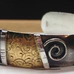 Pen-plated bracelet with oxidation and texturing