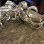 pile of various textured silver spinner rings