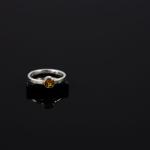 Silver ring with a yellow stone