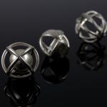 Three silver cage spheres