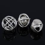 Three silver cage spheres