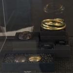 Photograph of creative jewelry in a display case.