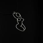 A silver wire pendant depicting a woman's body on a black cord.