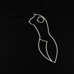 Photograph of a silver wire pendant shaped like a female body against a black background.