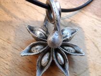 Seed pod cast in silver